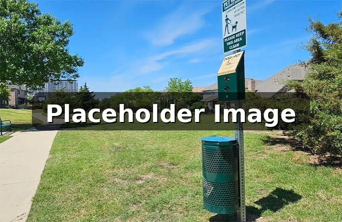 A pet waste station kept clean and stocked in a community common area