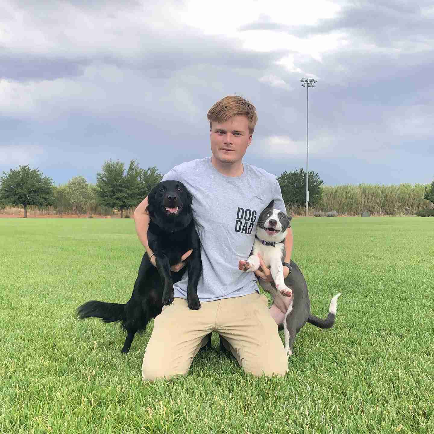 Dog Dad Holding Dogs